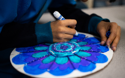 Student coloring an art project 